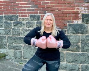 Jacqueline wearing Athleta Outfit and Everlast Boxing Gloves